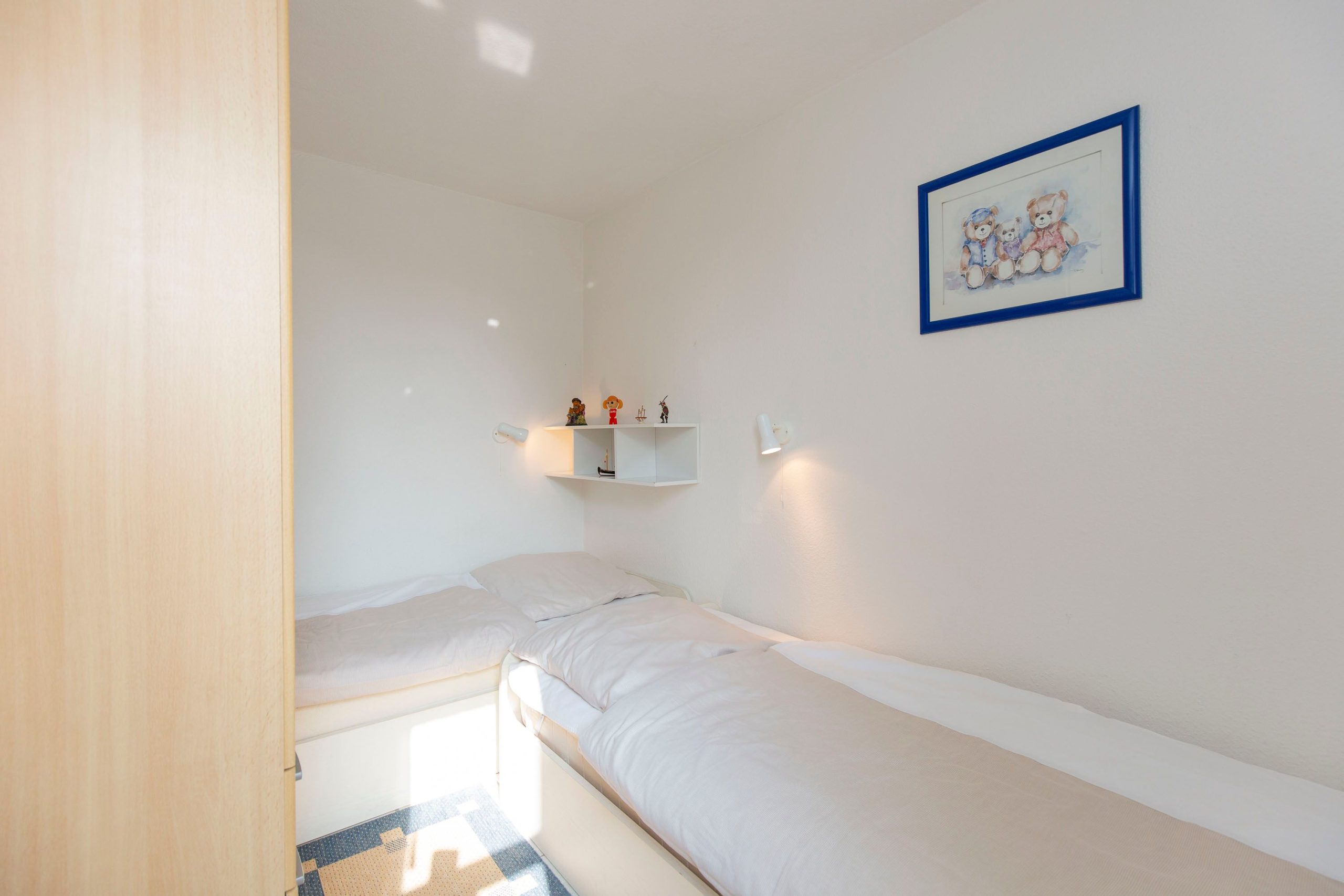 Schlafzimmer mit zwei Einzelbetten in Ferienwohnung in Cuxhaven